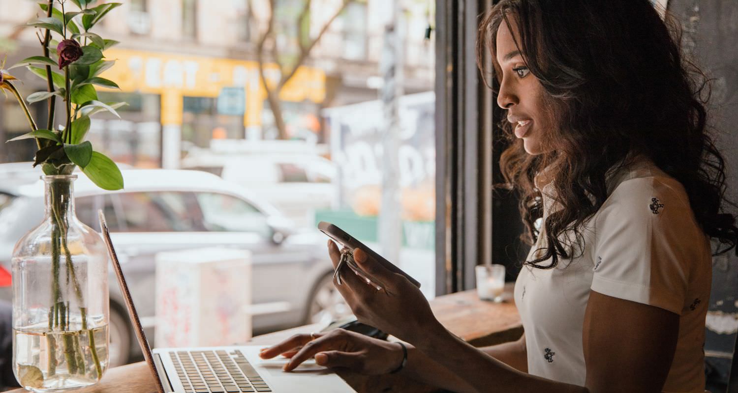 Simply Passive vs Digital Wealth Academy Marketer building automated sales funnel on her laptop